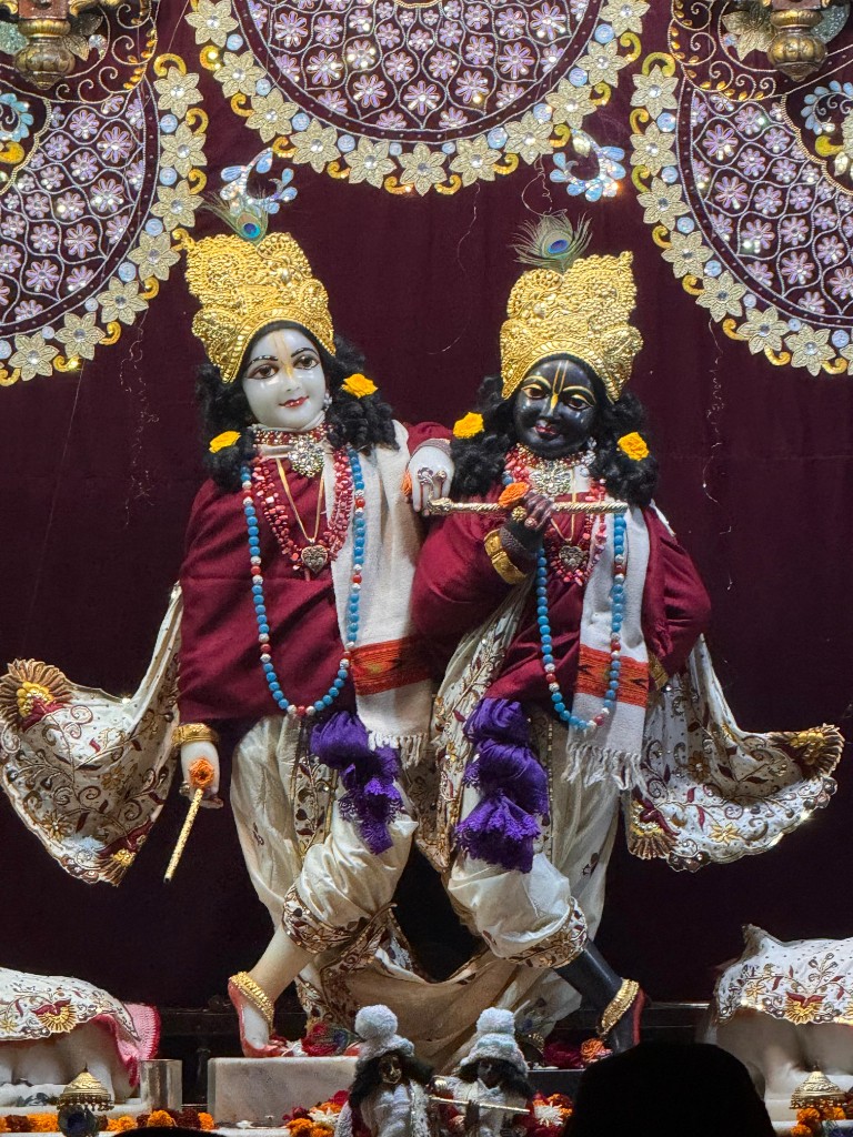 Krishna and Balaram standing together on the altar